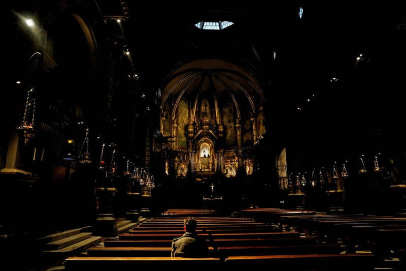 Miguel Hurtado, 36, who says he was sexually abused at the age of 16 by a Benedictine monk from Montserrat Abbey in Catalonia, poses for a portrait inside the church of the abbey in Montserrat, outside Barcelona, Spain, in this Feb. 2, 2019, file photo. (CNS photo/Susana Vera, Reuters)
