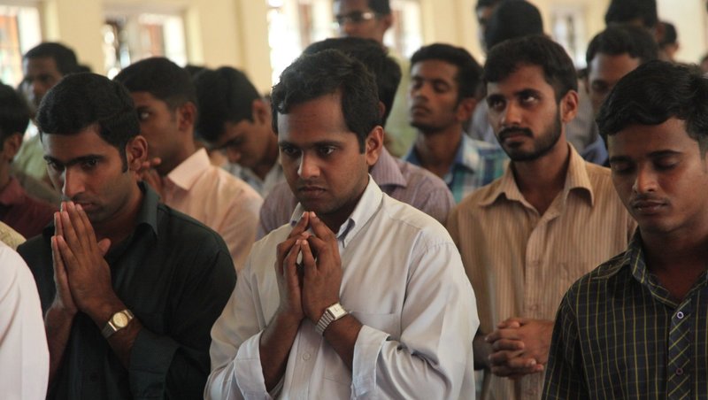 Seminarians pray at St. Joseph Pontifical Seminary of the Syro-Malabar Catholic Church in India's Kerala state in this 2012 file photo. Prominent Indian citizens, including Christians, have demanded a repeal of all anti-conversion laws in the country, saying they are used to target minorities. (CNS photo/Msgr. John E. Kozar, courtesy of CNEWA)
