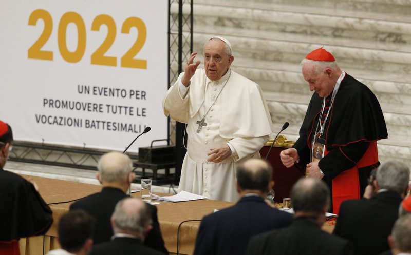 Pope Francis gives his blessing after giving the opening talk at an international symposium on the priesthood at the Vatican Feb. 17, 2022. Also pictured is Cardinal Marc Ouellet, prefect of the Congregation for Bishops. (CNS photo/Paul Haring)