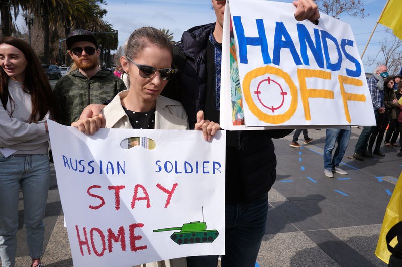 People in San Francisco gather for a "Stand with Ukraine" rally Feb. 20, 2022. About 150 people, mostly from the Ukrainian community, called for an end to the Russian military buildup on Ukraine's border and urged the European Union to impose economic sanctions against Russia as a deterrent to an invasion of Ukraine. (CNS photo/David Maung)