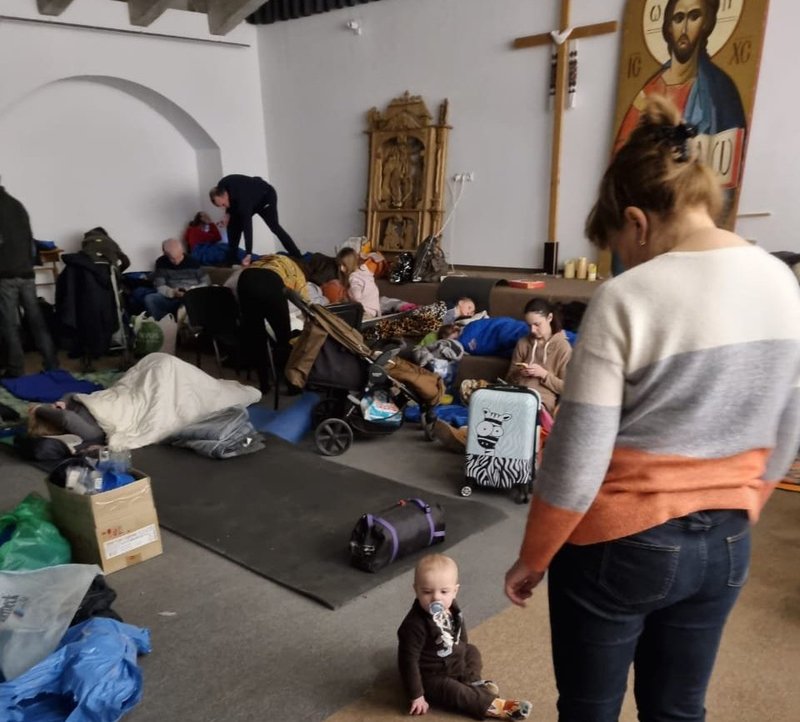 People take shelter in the basement of the Ukrainian Catholic Cathedral of the Resurrection in Kyiv, Ukraine, Feb. 25, 2022, after Russia launched a massive military operation against Ukraine. As some Ukrainians fled their homes, others remained trapped because of clogged roads and martial law. (CNS photo/courtesy Ukrainian Greek Catholic Church)
