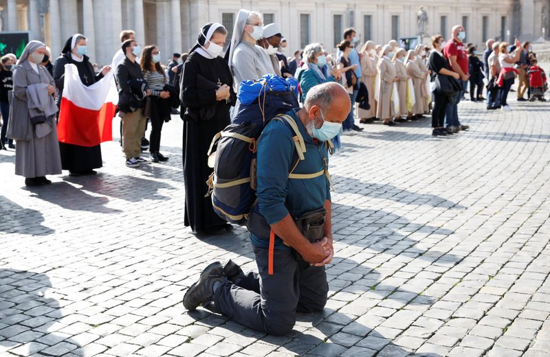 People in St. Peter's Square pray as Pope Francis leads the Angelus at the Vatican Oct. 25, 2020. (CNS photo/Remo Casilli, Reuters)