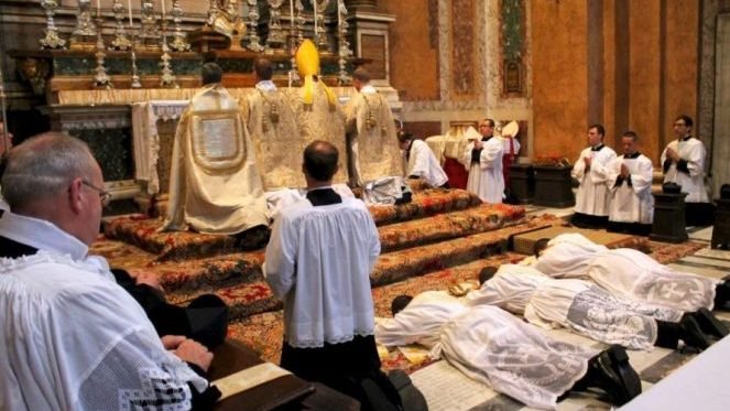 June 22,2013: The prostration of the ordinands during the Litany of the Saints at the Fraternity of St. Peter's Roman parish, Santissima Trinità dei Pellegrini in Rome. (CNA)