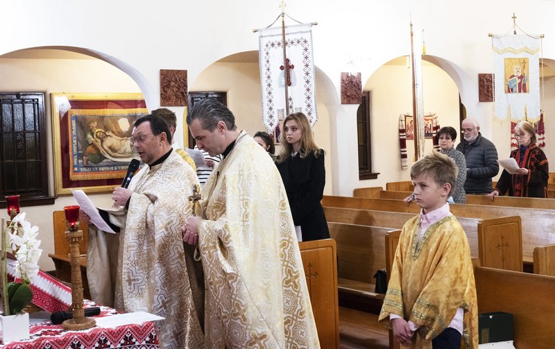 Father Ihor Koshyk (center) was joined by an Orthodox priest at a Feb. 24 prayer vigil for Ukraine at Nativity of Blessed Virgin Mary Ukrainian Catholic Church in East Hollywood. (Victor Alemán)
