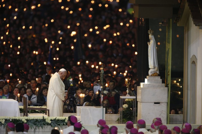 Pope Francis leads a vigil in the Little Chapel of the Apparitions at the Shrine of Our Lady of Fatima in Portugal in 2017. (CNS photo/Paul Haring)