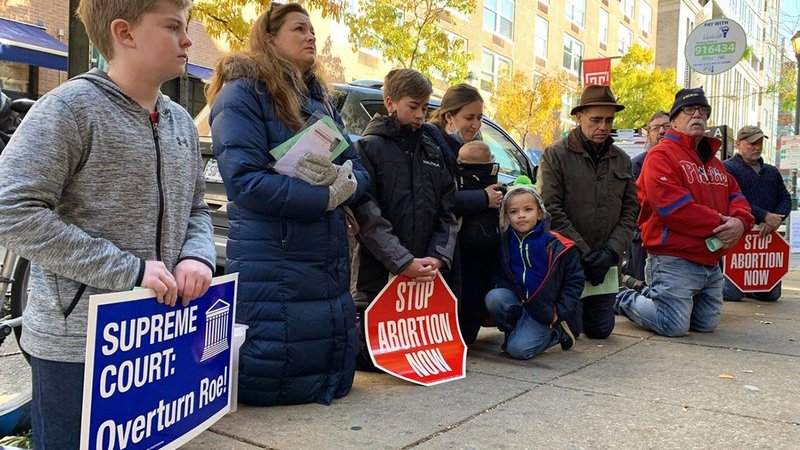 Ashley Garecht, second from left, joins a prayer vigil outside a Philadelphia Planned Parenthood site Dec. 1, 2021. The event was organized by the Pro-Life Union of Greater Philadelphia as the Supreme Court considered a case from Mississippi banning most abortions after 15 weeks. A decision in the case, Dobbs v. Jackson Women's Health Organization, could lead to the court overturning its 1973 Roe decision that legalized abortion nationwide. (CNS photo/Gina Christian, CatholicPhilly.com)