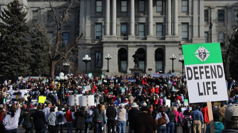 A participant holds a sign during the March for Life rally in front of the Colorado Capitol in Denver Jan. 17, 2015. The Colorado House of Representatives is considering passage of the Reproductive Health Equity Act, or H.B 22-1279, introduced March 3, 2022. Among other provisions, the measure would would codify Roe v. Wade in state law and make Colorado "the most radical abortion state in the country," according to the Colorado Catholic Conference. (CNS photo/Eileen Walsh)