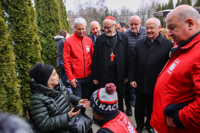 Canadian Cardinal Michael Czerny, interim president of the Dicastery for Promoting Integral Human Development, visits Ukrainian refugees in Barabás, Hungary, on March 9. (CNS/courtesy Lambert Attila/Magyar Kurír)