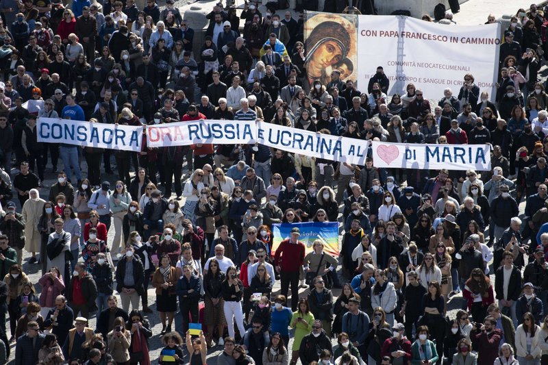 A sign in St. Peter's Square calls for the consecration of Russia and Ukraine to Mary, during Pope Francis' Angelus at the Vatican March 13, 2022. Appealing again for peace in Ukraine, Pope Francis said those who support violence profane the name of God. (CNS photo/Vatican Media)