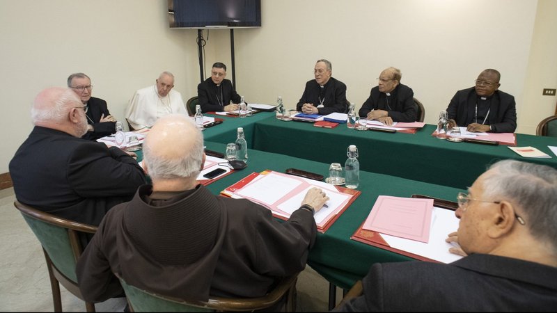 Pope Francis leads a meeting of his Council of Cardinals at the Vatican Feb. 21, 2022. On March 19, 2022, Pope Francis promulgated the long-awaited constitution reorganizing the Roman Curia. (CNS photo/Vatican Media)