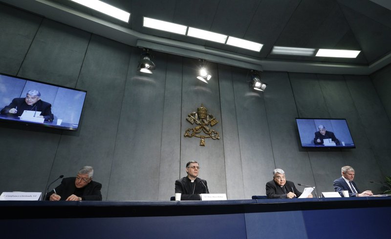 Cardinal Marcello Semeraro, prefect of the Congregation for Saints' Causes, speaks at a news conference to present Pope Francis' document, "Praedicate Evangelium" ("Preach the Gospel"), for the reform of the Roman Curia, during a news conference at the Vatican March 21, 2022. The pope has promulgated the constitution reorganizing the Roman Curia to highlight its role in promoting the church as a community of missionary disciples. Also pictured are Jesuit Father Gianfranco Ghirlanda, a canon lawyer and former rector of Rome's Pontifical Gregorian University; Bishop Marco Mellino, secretary of Pope Francis' Council of Cardinals; and Matteo Bruni, Vatican spokesman. (CNS photo/Paul Haring)