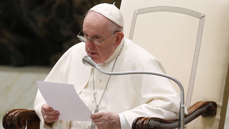 Pope Francis leads the crowd in praying for the victims of the war in Ukraine, during his general audience in the Paul VI hall at the Vatican March 23, 2022. The pope prayed that God would free the world from war and the need to self-destruct, saying that "war is a defeat for humanity." (CNS photo/Paul Haring)