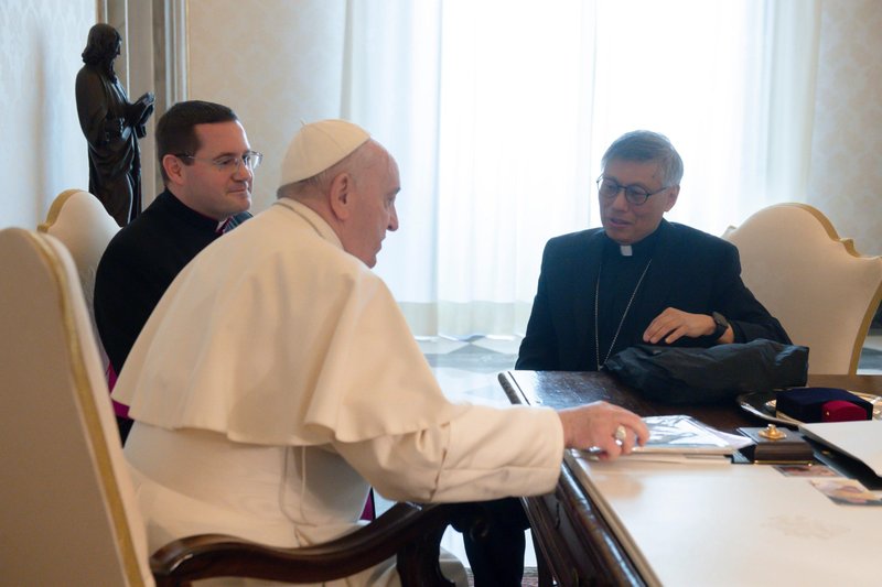 Pope Francis meets with Bishop Stephen Chow Sau-yan of Hong Kong at the Vatican March 17, 2022. During the meeting, Bishop Chow used his phone to record video messages from the pope to the people of Hong Kong and China. (CNS photo/Vatican Media)