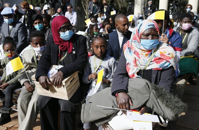 People wait for the start of Pope Francis' meeting with migrants at the John XXIII Peace Lab's Center for Migrants in Hal Far, Malta, April 3, 2022. (CNS photo/Paul Haring)