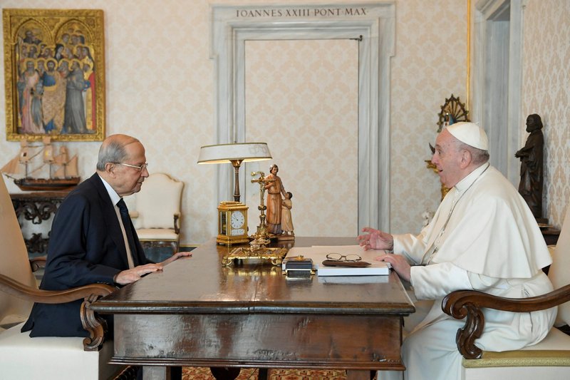 Pope Francis speaks with Lebanese President Michel Aoun during a private meeting at the Vatican March 21, 2022. Aoun tweeted April 5 that the nuncio has informed him Pope Francis is looking to visit the country in June. (CNS photo/Vatican Media via Reuters)