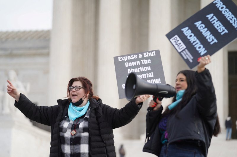 Activists Lauren Handy, left, and Terrisa Bukovinac chant slogans against legal abortion outside the Supreme Court in Washington Dec. 10, 2021. Handy and Bukovinac, members of a group called Progressive Anti-Abortion Uprising, said at an April 5,2022, news conference that five fetuses police found in a member's District of Columbia home are "proof of illegal abortions." The group said they found the five fetuses and a number of others in medical waste discarded by an abortion clinic in the District. (CNS photo/Sarah Silbiger, Reuters)