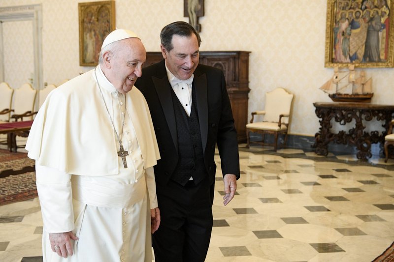 Pope Francis walks with Joe Donnelly, new U.S. ambassador to the Holy See, during a meeting for the ambassador to present his letters of credential, at the Vatican April 11, 2022. (CNS photo/Vatican Media)