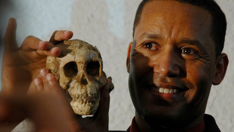 Ethiopian paleoanthropologist Zeresenay Alemseged unveils the skull named "Selam," discovered in an area of Ethiopia called Dikika, in the Ethiopian capital, Addis Ababa, in this Sept. 20, 2006, file photo. Alemseged, who discovered the fossilized remains of the "world's oldest child," has been appointed by Pope Francis as a member of the Pontifical Academy of Sciences. (CNS photo/Euan Denholm, Reuters)