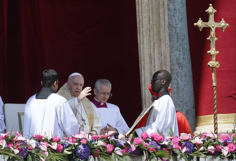 Pope Francis delivers his Easter blessing "urbi et orbi" (to the city and the world) from the central balcony of St. Peter's Basilica at the Vatican April 17, 2022. (CNS photo/Paul Haring)