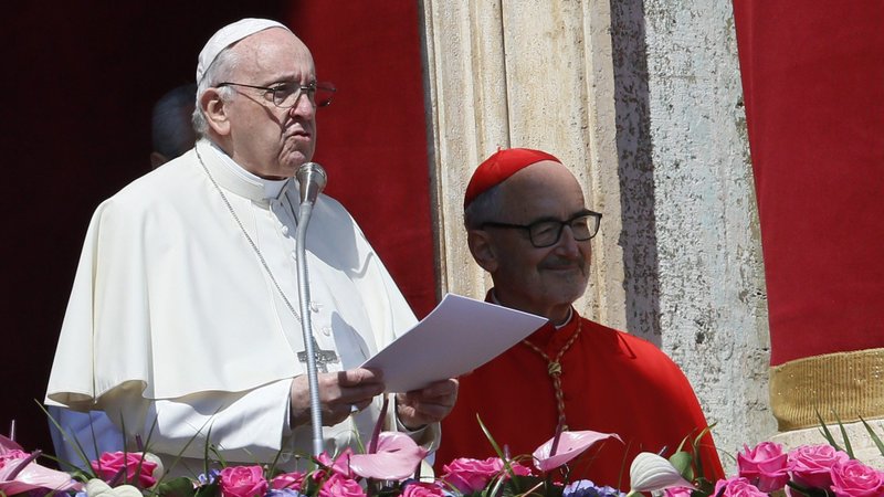 Pope Francis delivers his Easter message "urbi et orbi" (to the city and the world) from the central balcony of St. Peter's Basilica at the Vatican April 17, 2022. Also pictured is Cardinal Michael Czerny. (CNS photo/Paul Haring)
