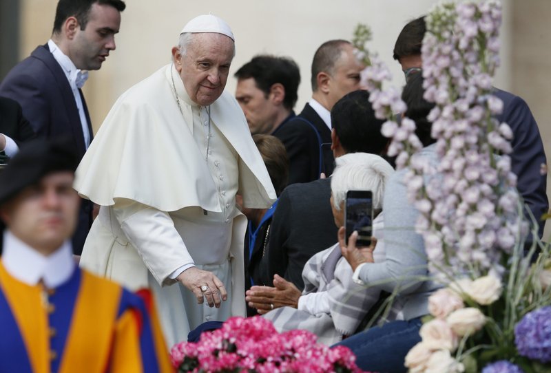 Pope Francis greets people during his general audience in St. Peter's Square at the Vatican April 20, 2022. (CNS photo/Paul Haring)