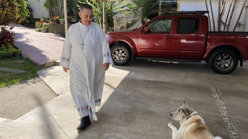 Mexican Bishop Salvador Rangel Mendoza of Chilpancingo-Chilapa approaches his dog, Taro, at his residence in Chilpancingo, Mexico, March 15, 2022. Bishop Rangel, now retired, often met with the leaders of drug cartels in an attempt to diminish violence in his diocese. (CNS photo/David Agren)
