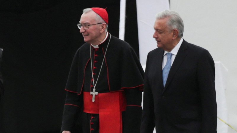 Cardinal Pietro Parolin, Vatican secretary of state, walks with Mexican President Andrés Manuel López Obrador during a private visit to a replica of the Sistine Chapel at Zocalo square in Mexico City April 26, 2022. (CNS photo/Henry Romero, Reuters)
