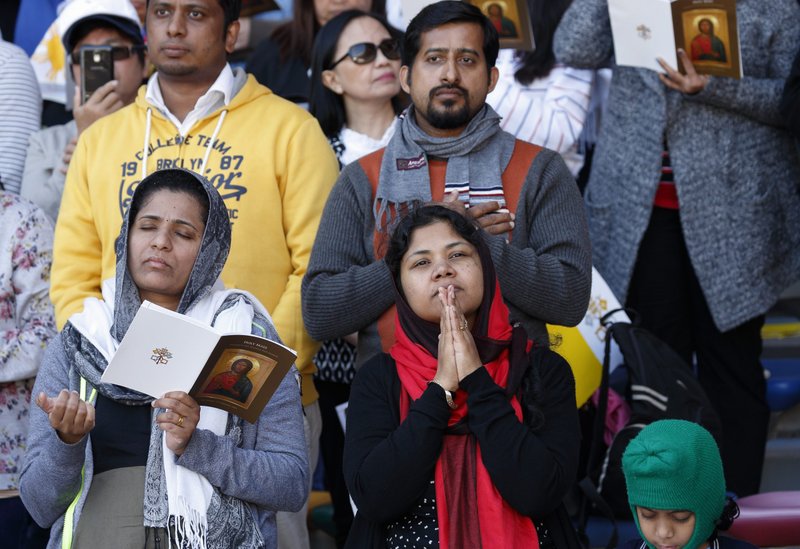 People pray as Pope Francis celebrates Mass at Zayed Sports City Stadium in Abu Dhabi, United Arab Emirates in 2019. (CNS photo/Paul Haring)