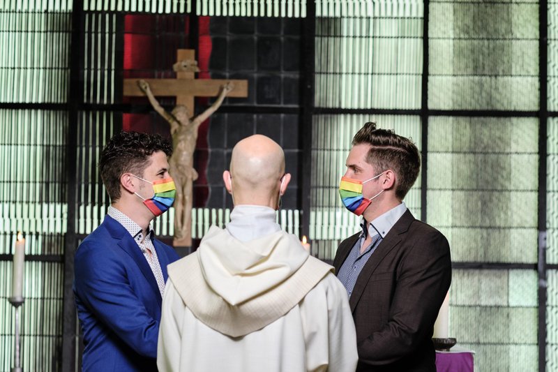 Father Christian Olding blesses a same-sex couple at the "Love Wins" blessing service at the Church of St. Martin in Geldern, Germany, May 6, 2021. (CNS photo/Rudolf Wichert, KNA)