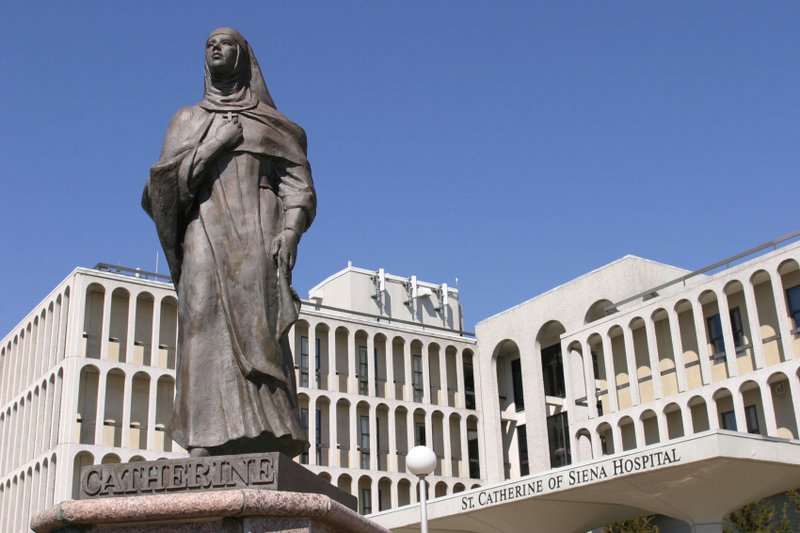 A statue of St. Catherine of Siena stands at the entrance to the medical center that bears her name in Smithtown, N.Y. (CNS photo/Gregory A. Shemitz, Long Island Catholic)
