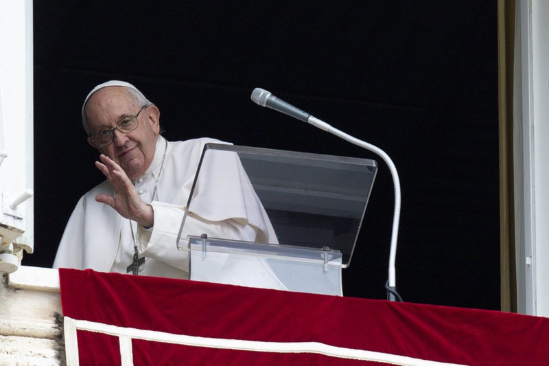 Pope Francis greets people as he leads the "Regina Coeli" from the window of his studio overlooking St. Peter's Square at the Vatican May 1, 2022. The pope appealed for peace in Ukraine and called the suffering of vulnerable elderly and children a "macabre regression of humanity." (CNS photo/Vatican Media)
