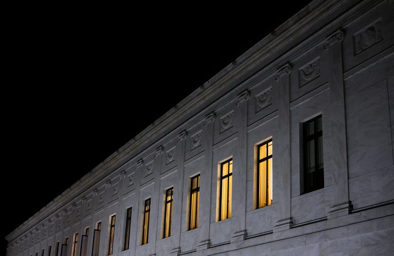 Lights burn inside U.S. Supreme Court offices in Washington May 2, 2022, after the leak of a draft majority opinion written by Justice Samuel Alito preparing for a majority of the court to overturn the landmark Roe v. Wade abortion rights decision later this year. (CNS photo/Jonathan Ernst, Reuters)