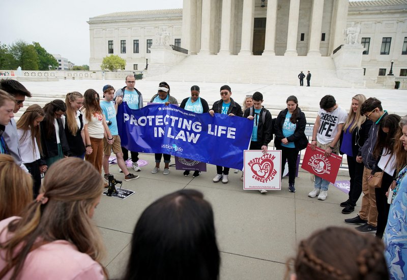 Demonstrators are seen outside the U.S. Supreme Court in Washington May 3, 2022, after the leak of a draft majority opinion written by Justice Samuel Alito preparing for a majority of the court to overturn the landmark Roe v. Wade abortion rights decision later this year. (CNS photo/Elizabeth Frantz, Reuters)