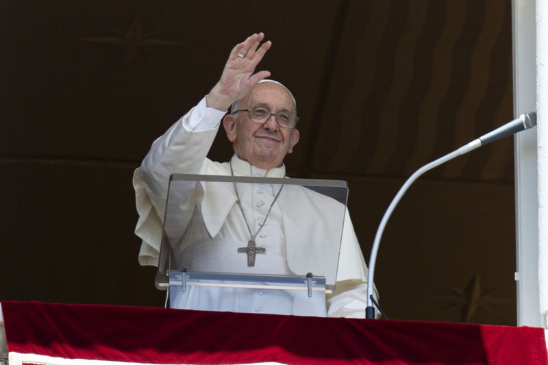 Pope Francis greets the crowd as he leads the "Regina Coeli" from the window of his studio overlooking St. Peter's Square at the Vatican May 22, 2022. The pope prayed that the church in China may live in greater communion with the universal church, in freedom and tranquility. (CNS photo/Vatican Media)