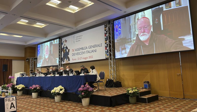 Members of the Italian bishops' conference listen to a video message from Boston Cardinal Seán P. O'Malley, president of the Pontifical Commission for the Protection of Minors, during their spring meeting in Rome May 25, 2022. Cardinal O'Malley encouraged the bishops "to undertake a constructive process of review, of reform and of reconciliation" in view of calls for a national study on clerical sexual abuse. (CNS photo/courtesy Pontifical Commission for the Protection of Minors)