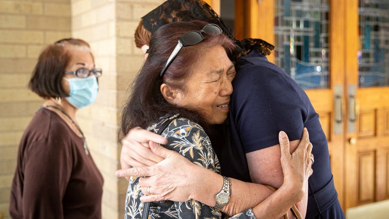 Rose Conner, a substitute teacher in Uvalde, Texas, hugs a woman outside Sacred Heart Catholic Church May 25, 2022, one day after a gunman killed 19 children and two teachers at Robb Elementary School. (CNS photo/Angela Piazza, USA TODAY NETWORK via Reuters)
