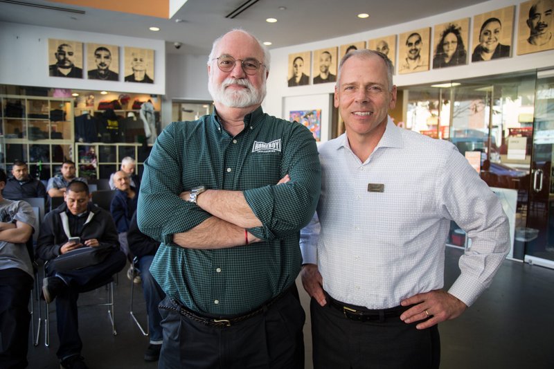 Father Greg Boyle, SJ, and Tom Vozzo at Homeboy Industries. (Homeboy Industries)