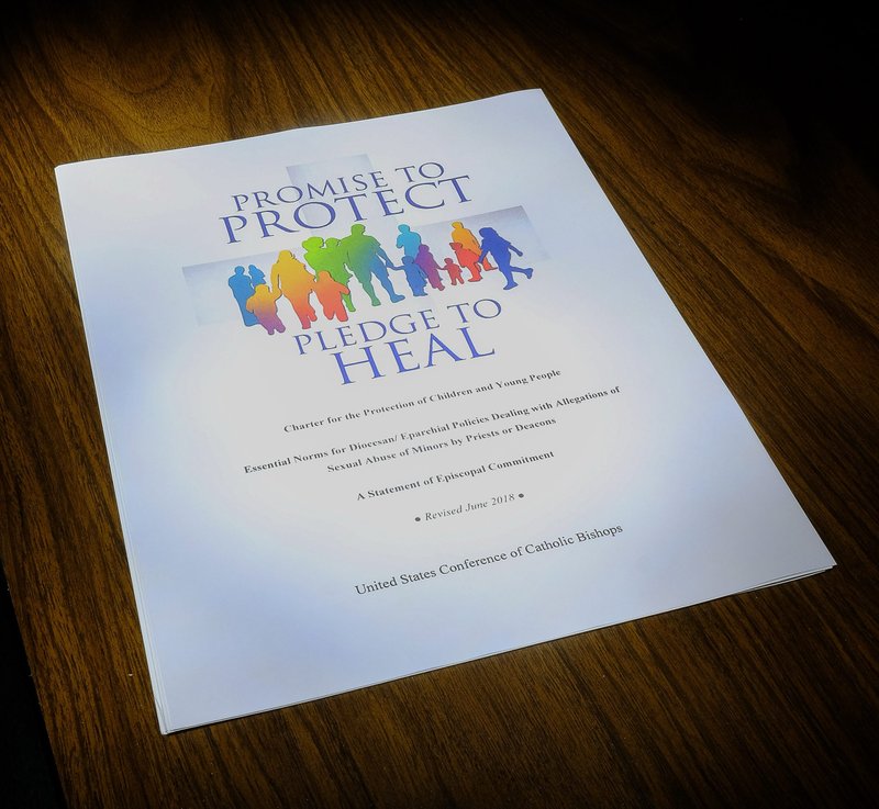 This is the cover of the USCCB "Charter for the Protection of Children and Young People." (CNS photo illustration/Rick Musacchio, Tennessee Register)