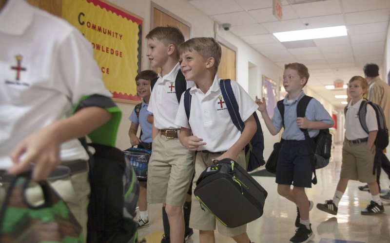 Third graders walk through a hallway at Christ the King School in Nashville, Tenn. (CNS photo/Rick Musacchio, Tennessee Register)