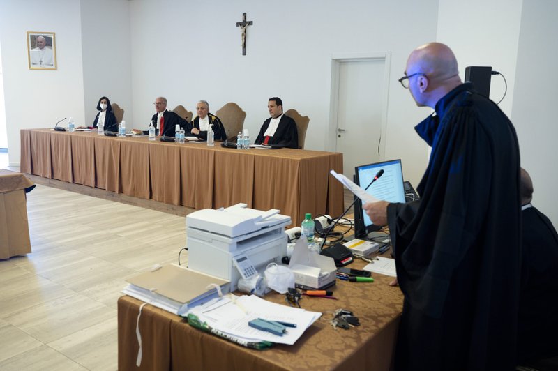 Vatican judges are pictured during the 17th session of the trial of defendants accused of financial crimes at the Vatican in this May 20, 2022, file photo. The trial has shed light on a proposed investment in an oil platform in Angola. Vatican officials studied the proposal during the time Pope Francis was drafting his 2015 encyclical on the environment. Pictured from left are judges Lucia Bozzi, Venerando Marano, Giuseppe Pignatone and Carlo Bonzano. (CNS photo/Vatican Media)