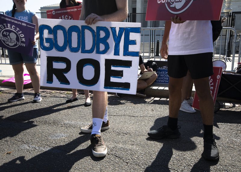 Pro-life demonstrators are seen near the Supreme Court in Washington June 15, 2022. The court overruled the landmark Roe v. Wade abortion decision in its ruling in the Dobbs case on a Mississippi law banning most abortions after 15 weeks June 24. (CNS photo/Tyler Orsburn)