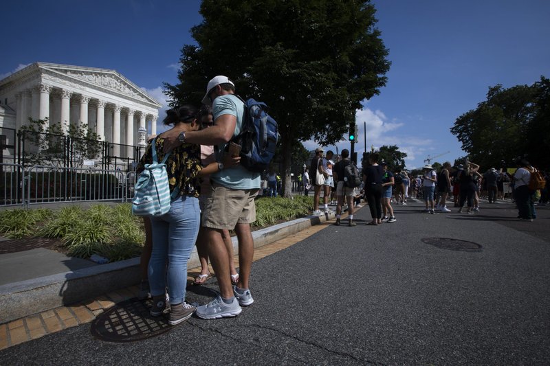 People pray near the Supreme Court in Washington June 24, 2022, as the court overruled the landmark Roe v. Wade abortion decision in its ruling in the Dobbs case, on a Mississippi law banning most abortions after 15 weeks. (CNS photo/Tyler Orsburn)