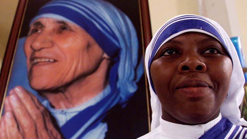 A member of the Missionaries of Charity is pictured in a file photo near an image of St. Teresa of Kolkata during Mass at the cathedral in Managua, Nicaragua. The religious order has been expelled from Nicaragua. (CNS photo/Oswaldo Rivas, Reuters)
