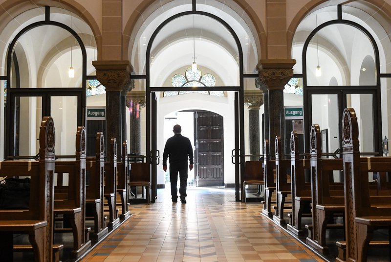 A man leaves an empty church in Bonn Germany, June 12, 2020, during the COVID-19 pandemic. The number of people resigning from membership in the Catholic Church has hit a new record in Germany in 2022. (CNS photo/Harald Oppitz, Reuters)