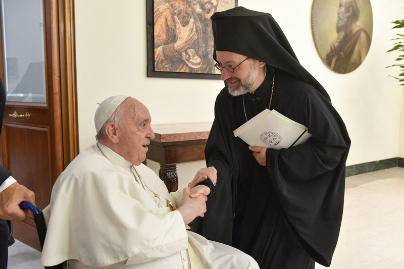 Pope Francis greets Orthodox Archbishop Job of Telmessos while meeting a delegation representing the Ecumenical Patriarchate of Constantinople at the Domus Sanctae Marthae at the Vatican June 30, 2022. The delegation was in Rome to celebrate the June 29 feast of Sts. Peter and Paul at the Vatican. (CNS photo/Vatican Media)