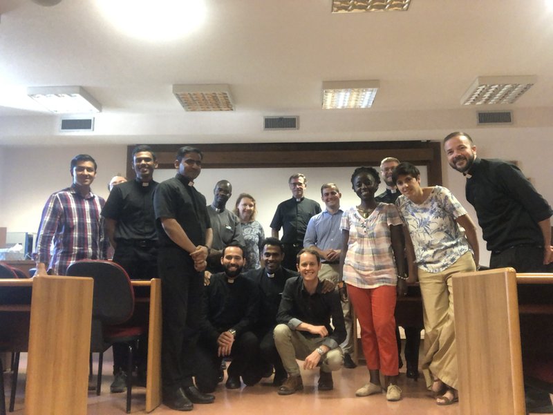 Father Humphrey (at far right) with theology classmates in a classroom at the Pontifical University of the Holy Cross in Rome.