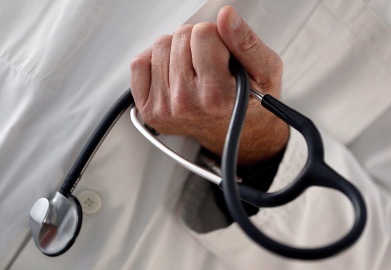 A doctor holds a stethoscope in this illustration photo. (CNS photo/Regis Duvignau, Reuters)