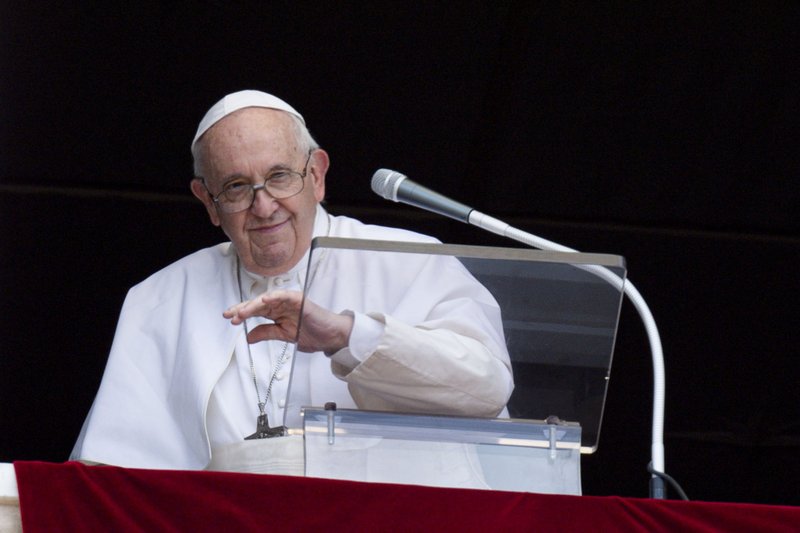 Pope Francis waves as he leads the Angelus from the window of his studio overlooking St. Peter's Square at the Vatican June 29, 2022. (CNS photo/Remo Casilli, Reuters)
