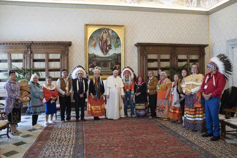 Pope Francis is pictured with Indigenous delegates from Canada's First Nations during a meeting at the Vatican in this March 31, 2022, file photo. The pope is expected to apologize directly to Indigenous peoples during his July 24-29 visit to Canada. (CNS photo/Vatican Media)