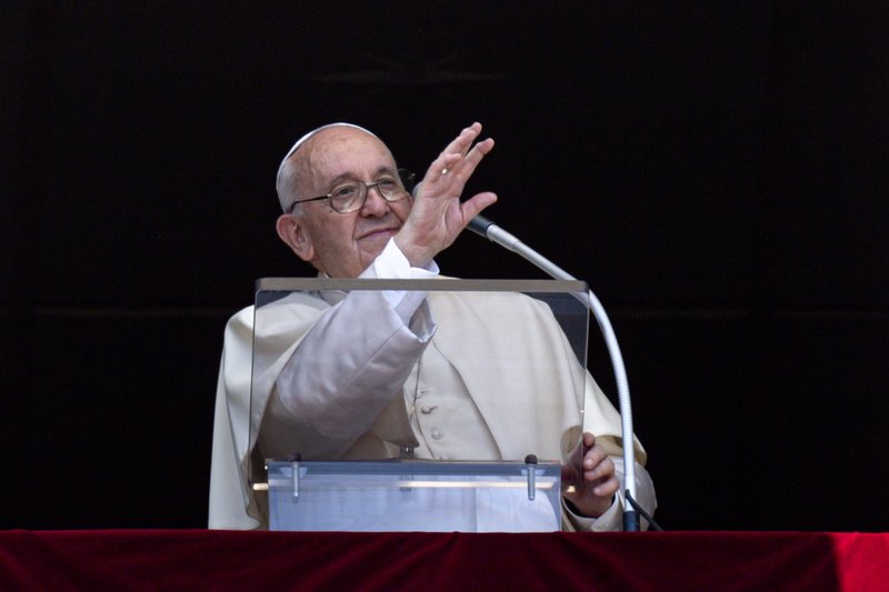 Pope Francis greets the crowd as he leads the Angelus from the window of his studio overlooking St. Peter's Square at the Vatican July 17, 2022. (CNS photo/Vatican Media)